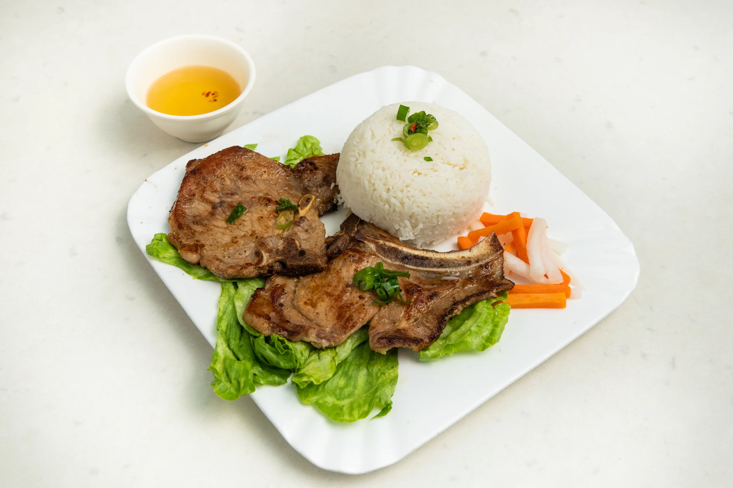 Pho Xe Lua BBQ pork chop on rice